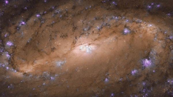 “Хаббл” показал скрытые глубины NGC 2903